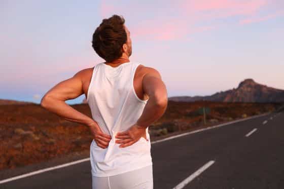 Man with back pain on a run